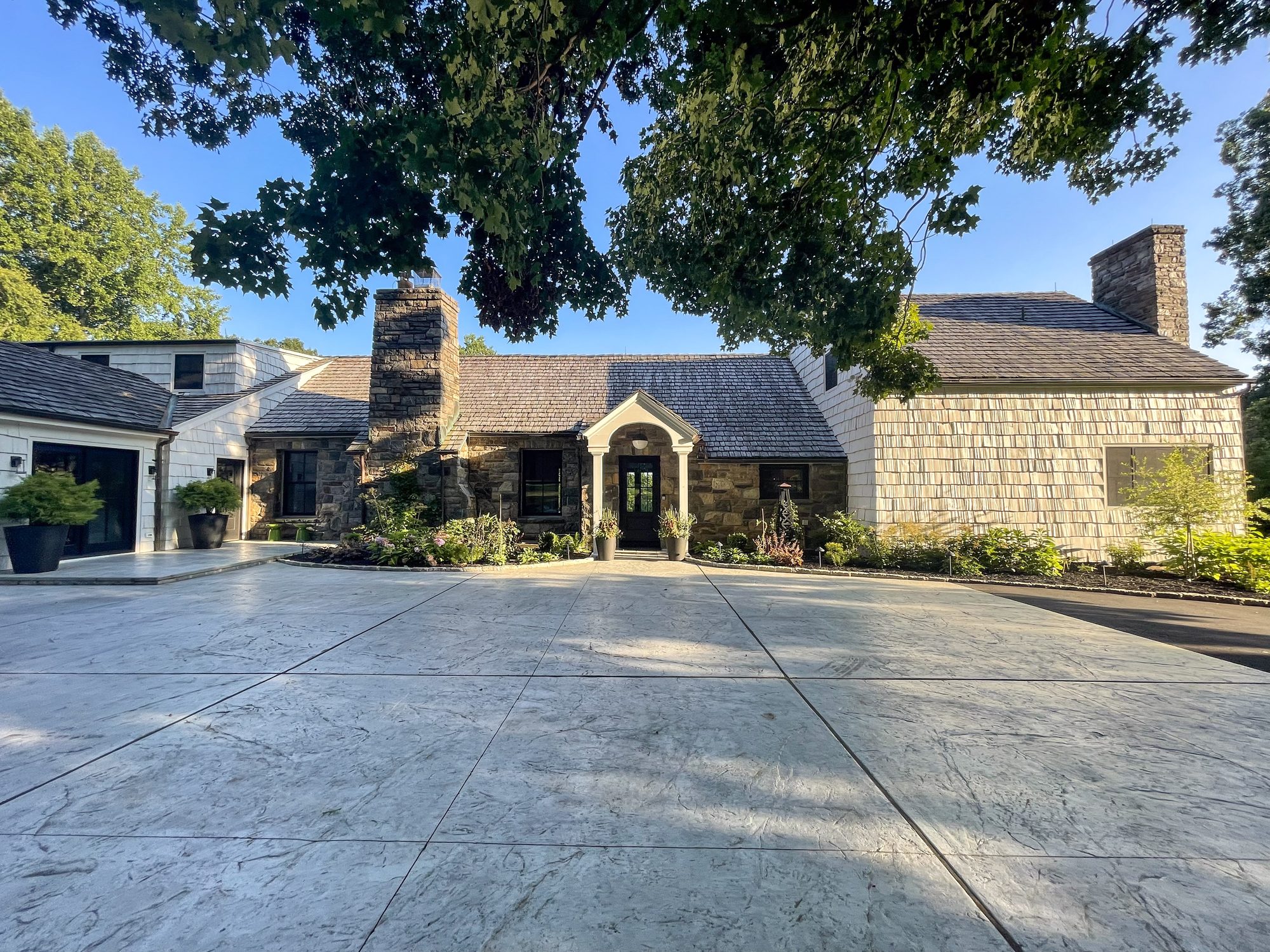 Stone farmhouse exterior with shingle addition, Yorktown NY