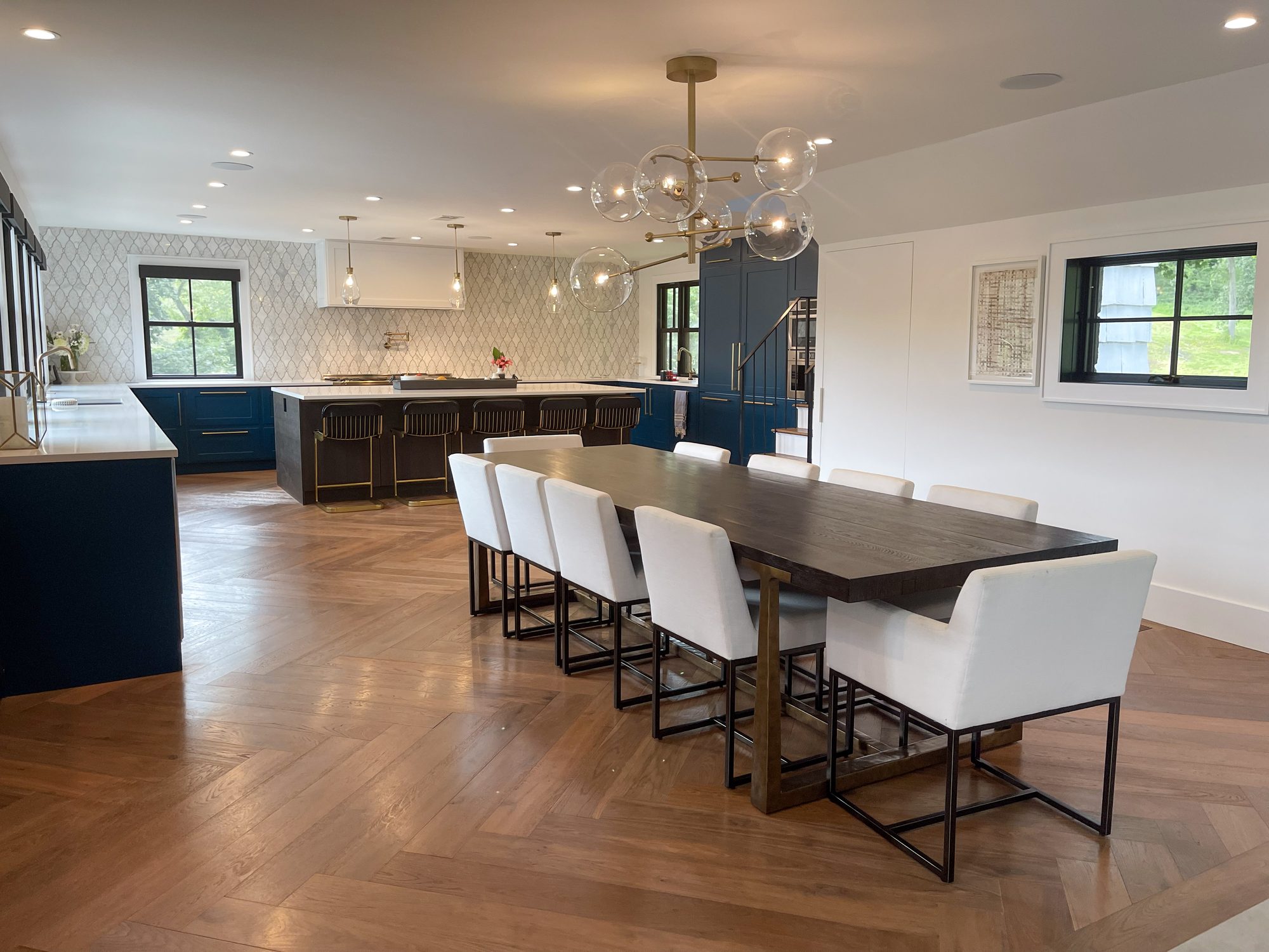 Open-plan kitchen and dining area with navy cabinetry