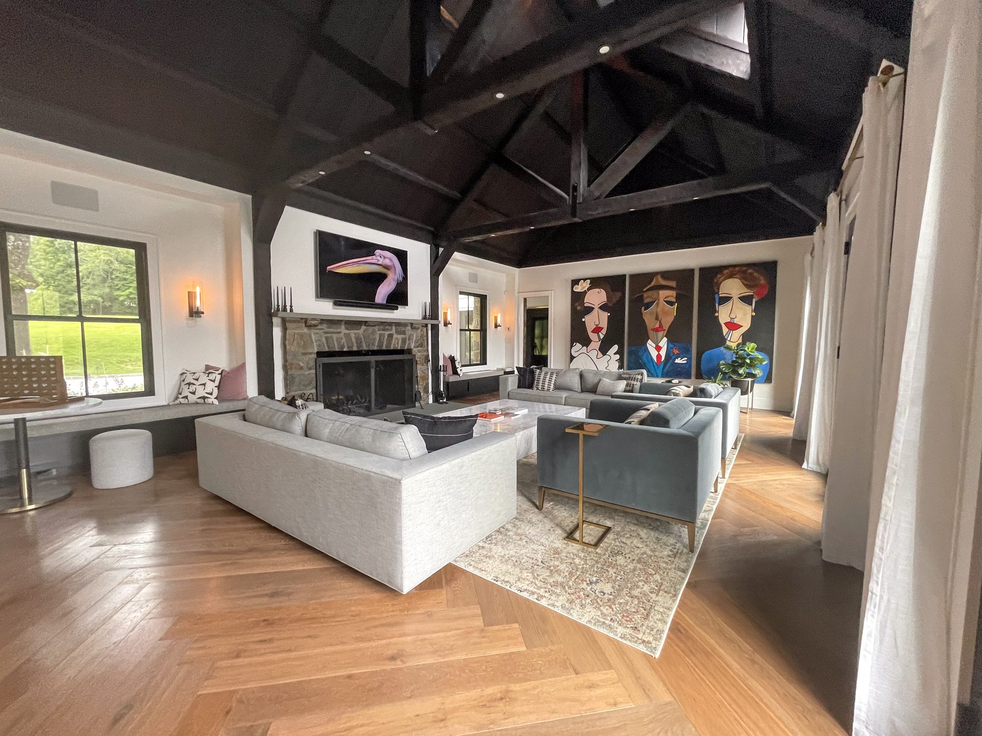 Vaulted-ceiling living room with stone fireplace