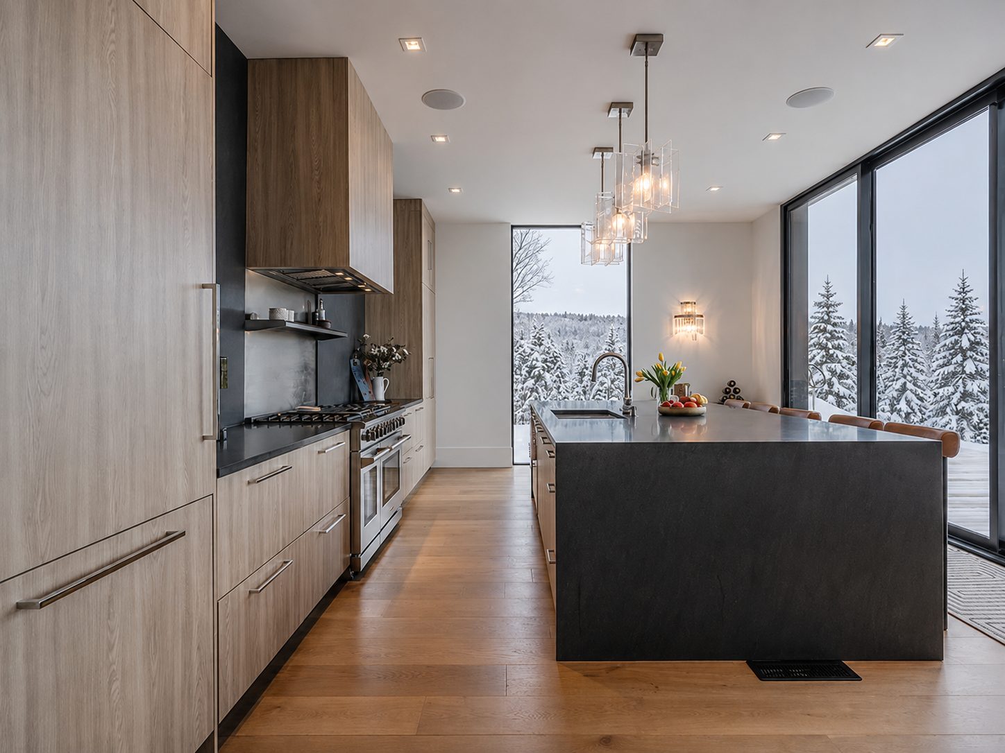Modern kitchen with dark stone island and wood cabinetry