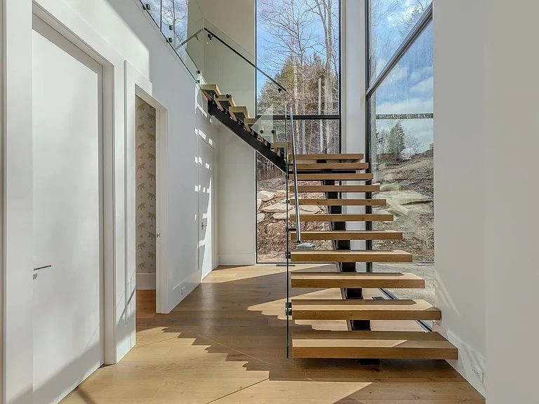 Free-standing steel and glass staircase