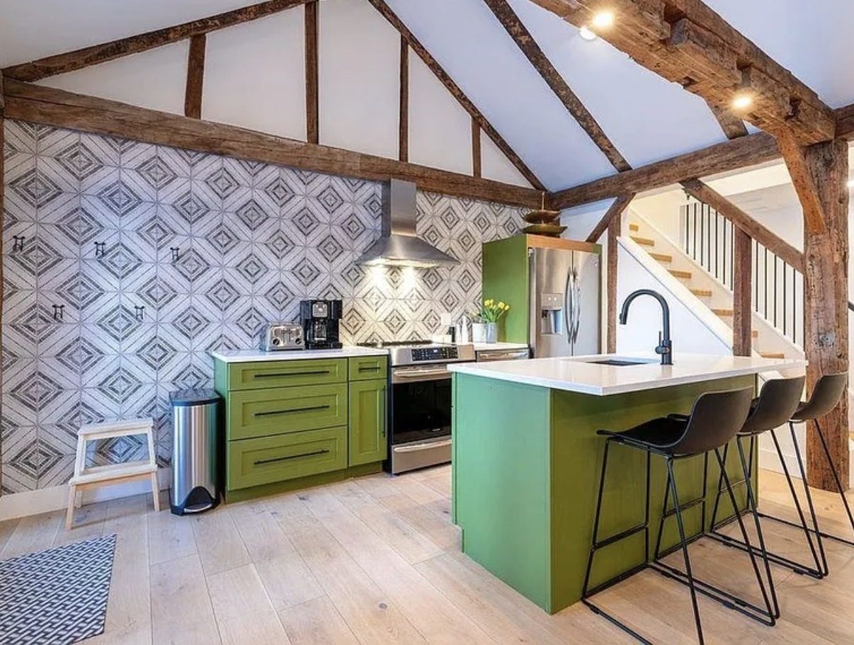 Kitchen with exposed timber frame and vaulted ceiling